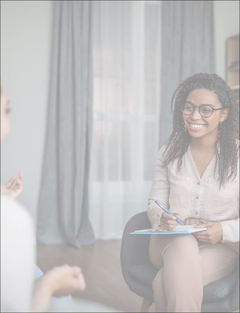 Woman smiling while speaking on the phone